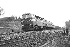 DSB MZ 1405 (type I) with freight train photographed in Fredericia December 1977.  The MZ class (type I and II) was purchased from 1967 to 1970 in a number of 26. Only a few of these engines remain in service by DSB - most are now sold to other companies. MZ 1405 was sold til Three T in Sweden in 2004. Built by NOHAB and Frichs. Dieselelectric. Co'Co'. 2270 kW - 3300 hp. Max speed 143 km/h - 89 mph. Length 20 800 mm. Weight 116,5 metric tonnes.
